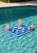 Bobbie's Shoppe blue mahjong pool mat with white trim, holding mahjong tiles and drinks in a pool.
