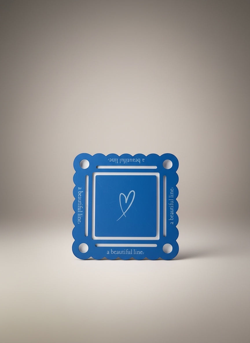 Bobbie's Shoppe blue mahjong pool mat with white bottom and heart graphic. Scalloped edges with text.